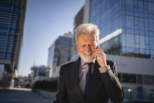 istock Chief executive officer making a deal via phone call 1254804449