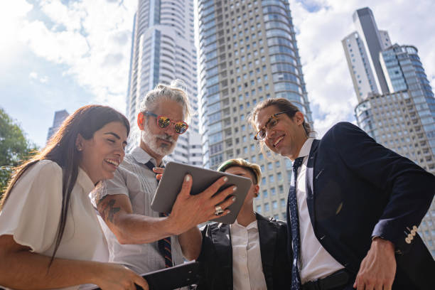 istock Cool boss brainstorming ideas with his workers outdoors 1254805379