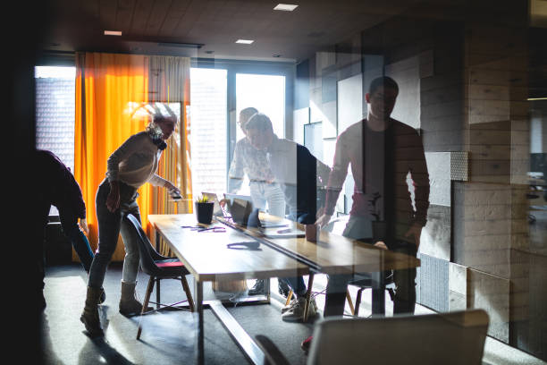 istock Team leaving their boarding room after a meeting 1254805887