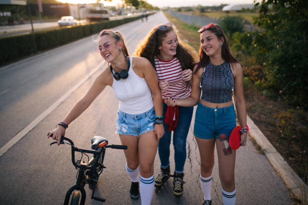 istock Girls riding and walking while on an adventurous summer day 1254806924