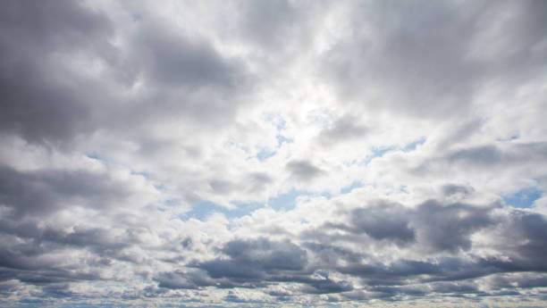 istock Storm clouds on the sky. Blue sky with white clouds 1254807144