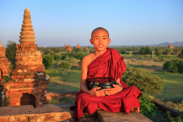 istock Young Buddhist monk looking at the view, Bagan, Myanmar 1254808353