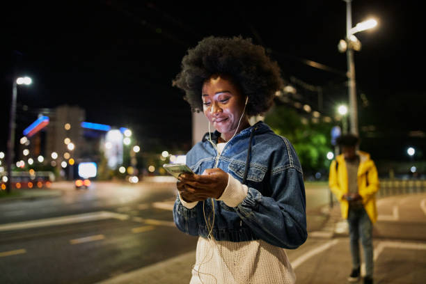 istock Unsuspecting young woman walking while being stalked 1254808489