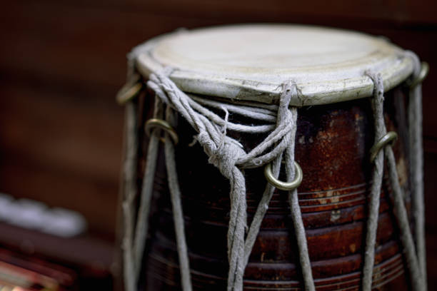 istock Hand drum on a wooden background 1254808924