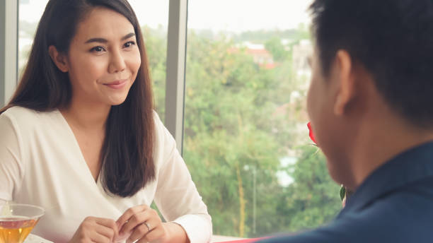 istock Happy romantic couple eating lunch at restaurant 1254813499