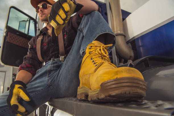 truck driver resting outdside of vehicle cab. - truck driver highway truck working imagens e fotografias de stock