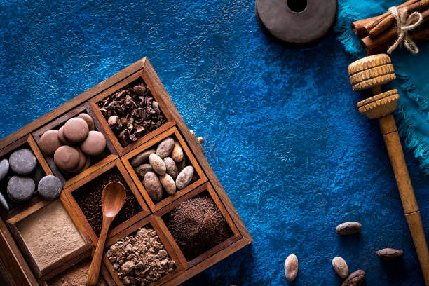 istock Chocolate box with cocoa beans and powder, chololate drops and chocolate beans 1254822786
