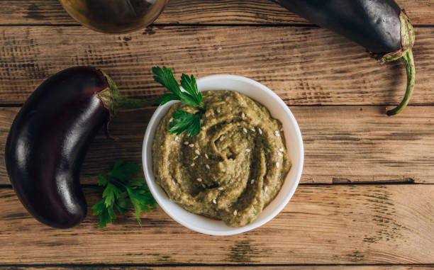 istock Traditional arabian eggplant dip baba ganoush on rustic wooden table 1254822904