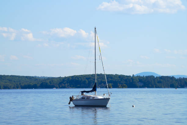 istock boat on lake blue sky summer vacation sailboat 1254825611