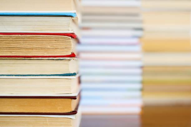 istock A stack of old books lies in the foreground. 1254825754