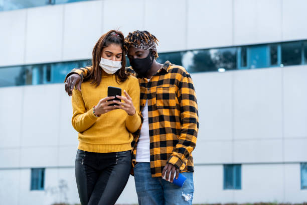 istock Latino friends check their mobile phone 1254825948