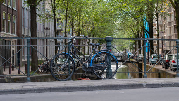 istock Bicycle parked near a canal in Amsterdam, Netherlands 1254827961
