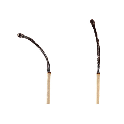 Two burnt matches close up on a white background. Isolated blank for design.