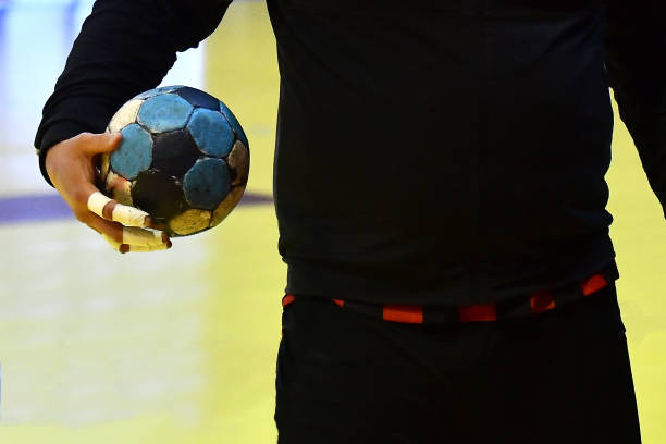 istock Handball player holding a ball 1254831527