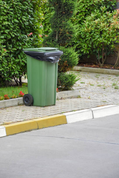istock Green recycle bin on the sidewalk 1254835106