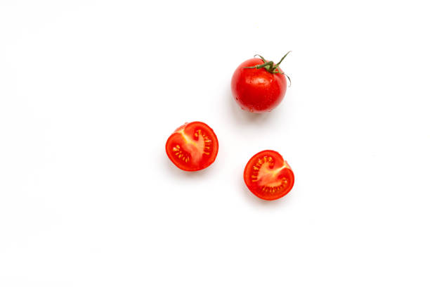 istock Fresh cherry tomatoes on a white background with copy space, flat lay. Raw food and vegetable concept 1254835824