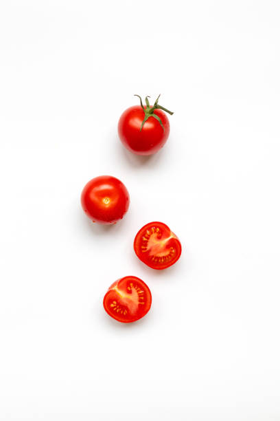Fresh cherry tomatoes with water drop isolated on a white background, top view, flat lay