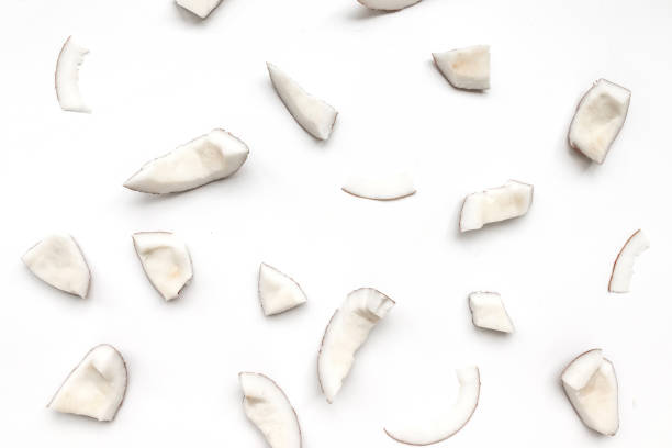 coconut pieces on a white background - shavings imagens e fotografias de stock