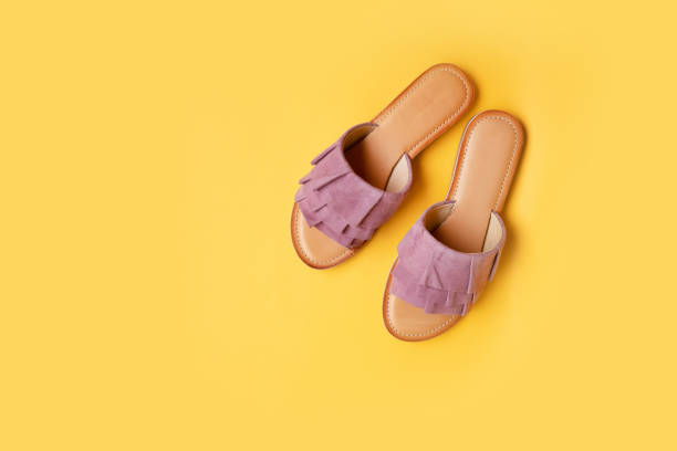 istock Stylish new shoes on a colored background, top view. Top view, flat lay 1254836016