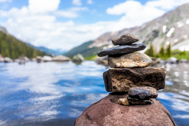 Hot springs pool peak and rock stack cairn on Conundrum Creek Trail in Aspen, Colorado in 2019 summer with view and nobody in USA Hot springs pool peak and rock stack cairn on Conundrum Creek Trail in Aspen, Colorado in 2019 summer with view and nobody in USA hot spring photos stock pictures, royalty-free photos & images