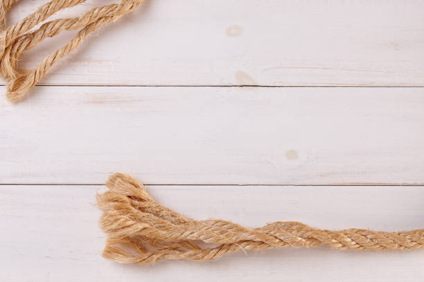 istock Ship Rope on Wooden Background 1254839746