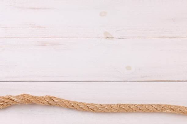 istock Ship Rope on Wooden Background 1254839842