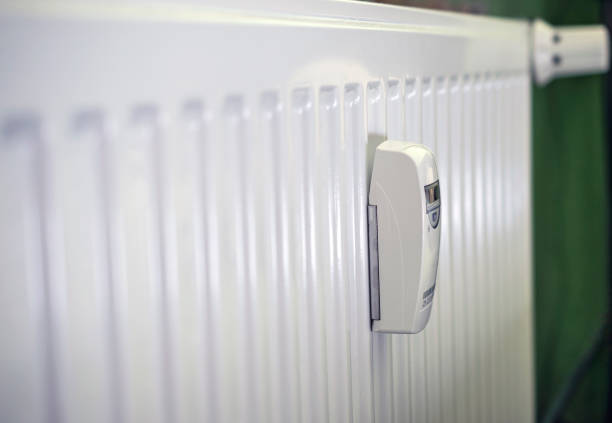 istock White radiator in an apartment with thermostat and temperature sensor 1254840032