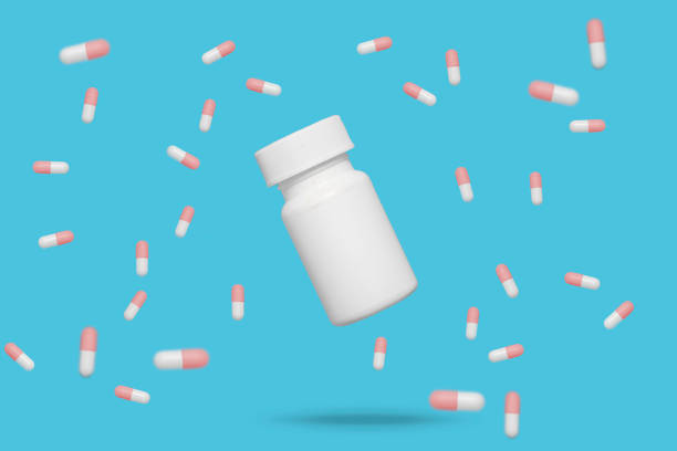 istock Red and white floating medicine pills 1254840494