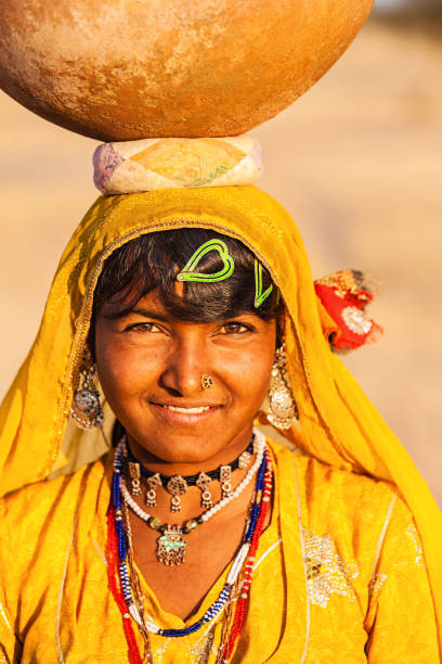 istock Indian woman carrying water, Rajasthan 1254840662