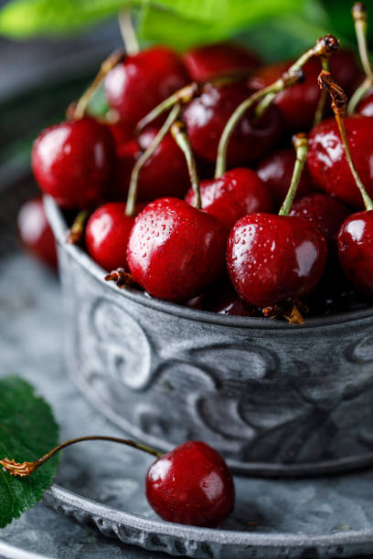 istock Fresh sweet cherries on table with water drops 1254840776