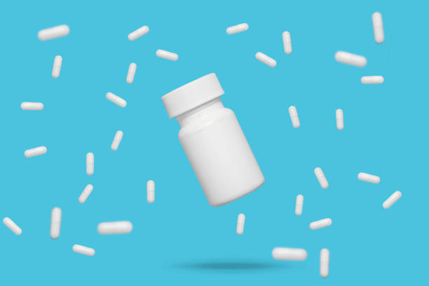 istock White floating medicine around floating pill bottle 1254841501