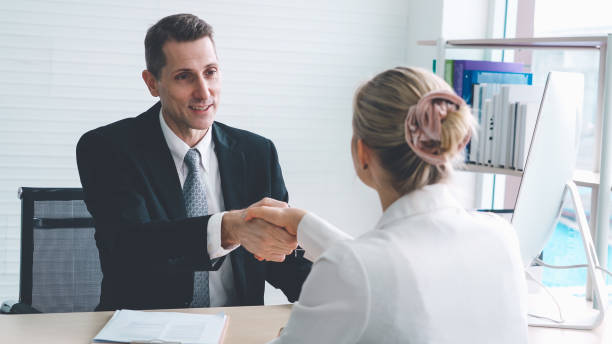 istock Job seeker and manager handshake in job interview 1254842644