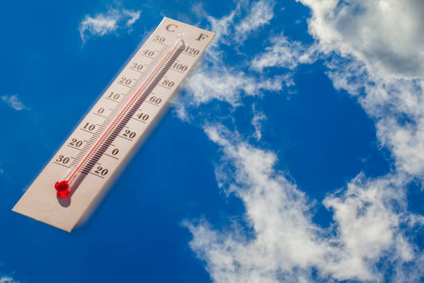 istock Temperatures in Celsius and Fahrenheit degrees. Hot summer weather, environment concept. 1254842867