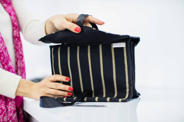 istock Hands are Holding the Fabric Handbag 1254846196