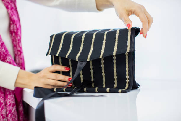 istock Hands are Holding the Fabric Handbag 1254846336