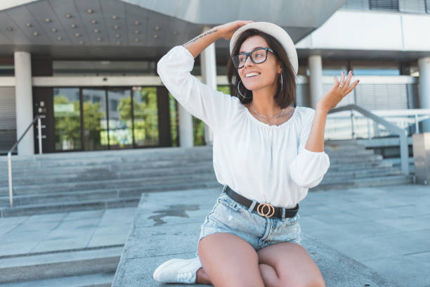 istock Young smiling girl  looking to side with hat und eyeglesses 1254848019