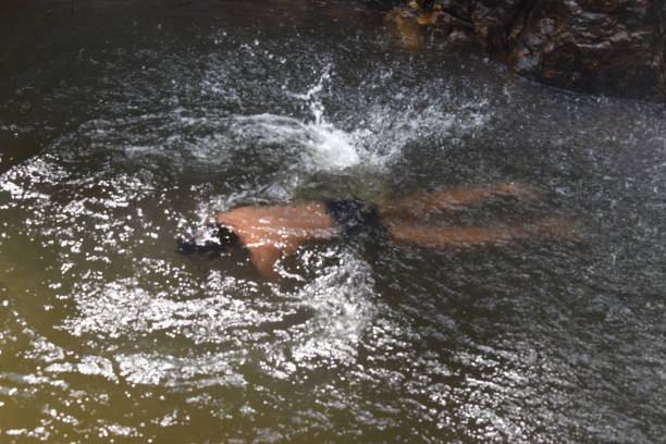 istock swimming man under the water 1254848088