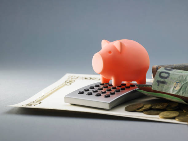 istock piggy bank on calculator 1254854615