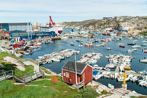 Greenland city Ilulissat cruise ship harbor and boat harbour on famous Greenland destination.