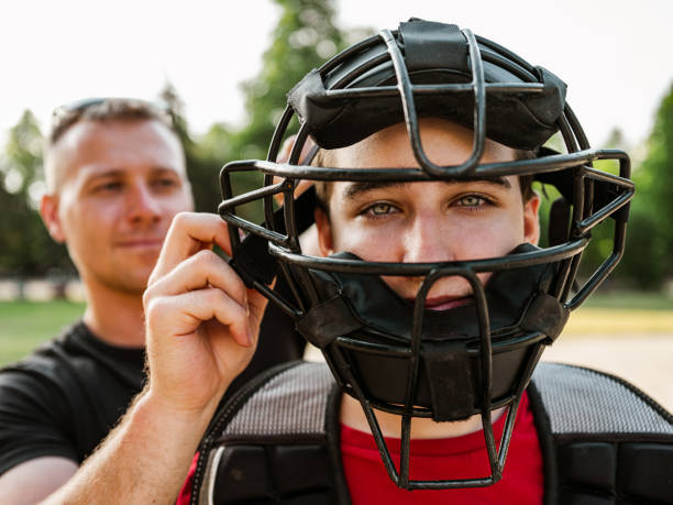 istock Young catcher and the coach 1254855179