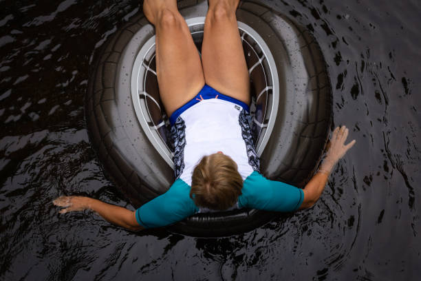 istock Woman floating down a river in inner tube 1254856415