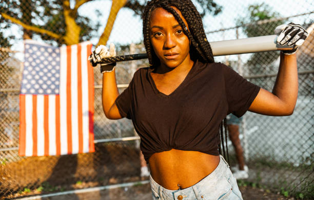 istock Young Black woman at the softball 1254858129
