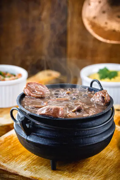 Feijoada mineira, typical food from minas gerais in iron pot.