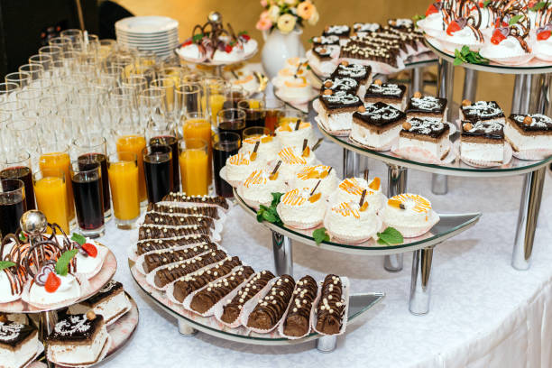 istock Festive banquet table with cakes and drinks 1254862544