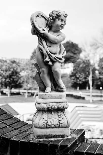 Statue of a boy on a stone wall black and white in Kirov, Kirov Oblast, Russia