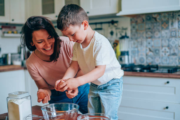 istock Mother and son cooking together. 1254866787