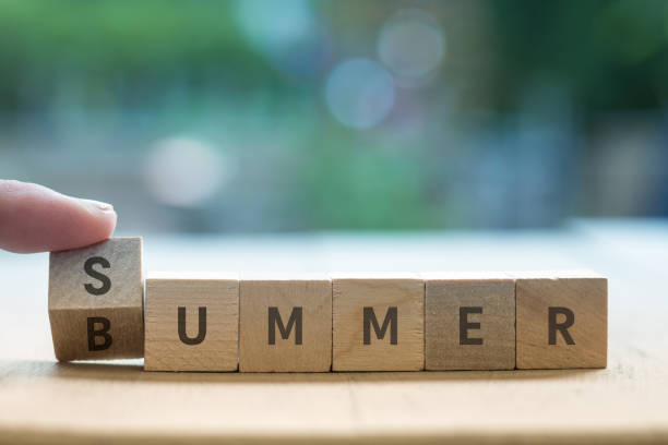 istock SUMMER BUMMER concept on wood blocks as finger changes S to B 1254866948