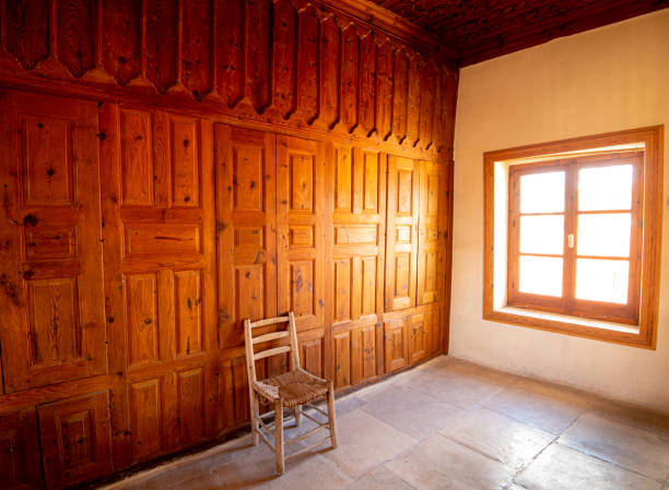 istock Empty room with wooden wall and bright sunshine through the open window 1254868209