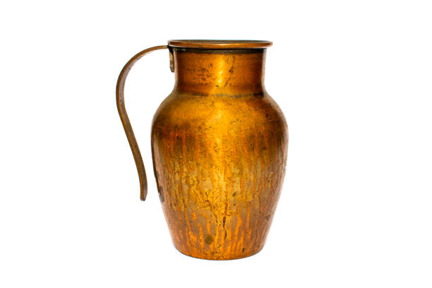 istock Bronze / copper jug / pot on white background 1254868429