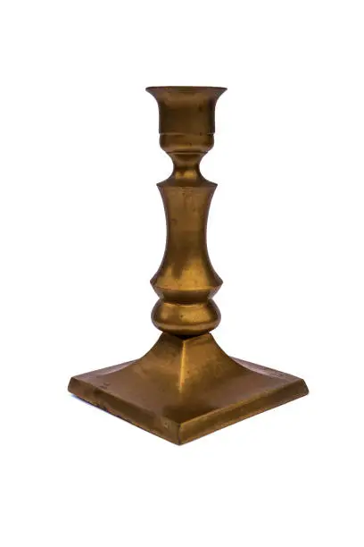 Photo of Bronze candlestick on white studio background